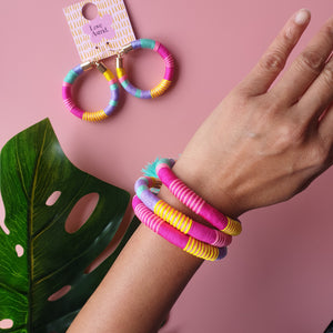 Handmade tassel bracelet crafted from vibrant coloured cords, designed to be lightweight and comfortable.