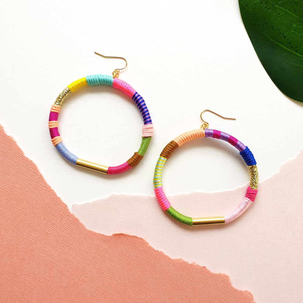 Colourful hoop earrings wrapped in vibrant, bold colours thread, featuring hypoallergenic gold-plated brass earring hooks 