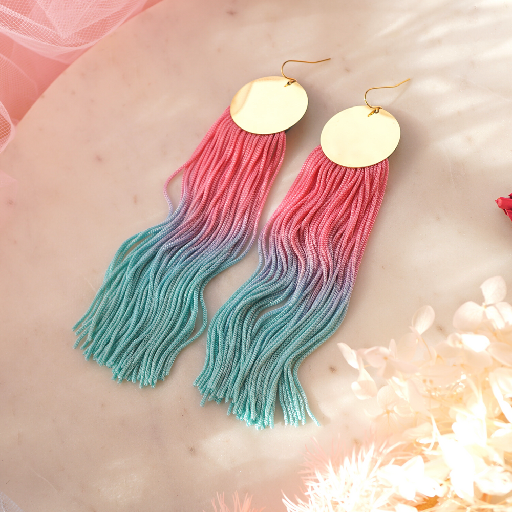 Hand-dyed pink-mint green ombre tassel earrings with a gold-plated pendant, featuring a vibrant, lightweight, and elegant design.