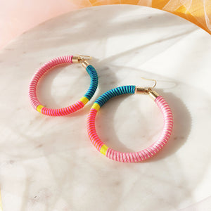 Pastel hoop earrings featuring a beautiful combination of pink, green, and yellow pastel colours for a soft, colourful look.